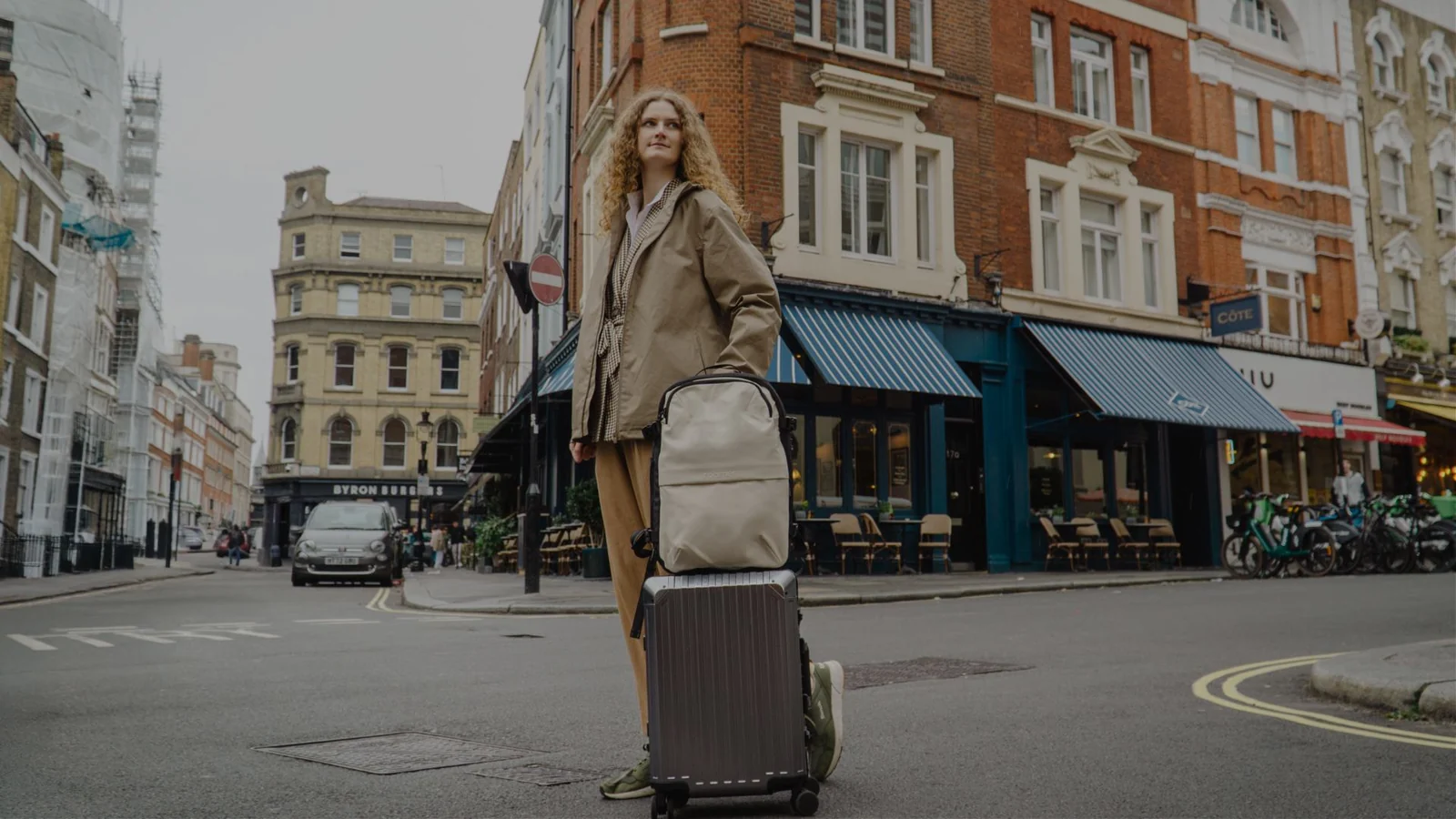 Traveler with luggage on a city street